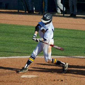Zayne pops a TeaZa for energy on the baseball field